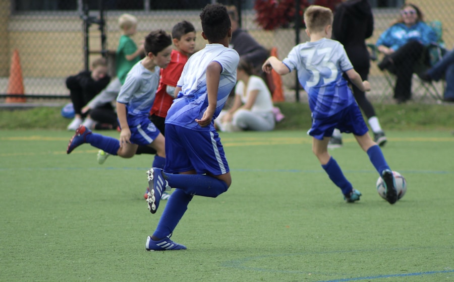 Children playing a soccer match on a field